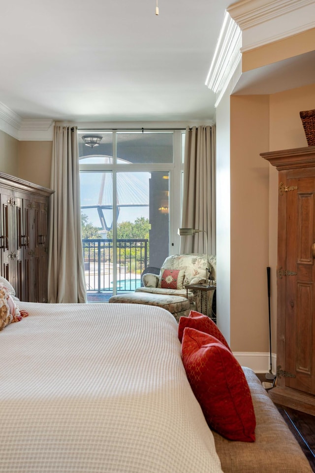bedroom featuring access to exterior and ornamental molding