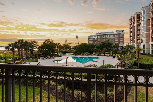 community pool featuring a patio area and fence