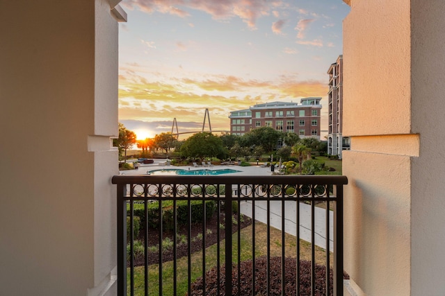 balcony featuring view of pool area