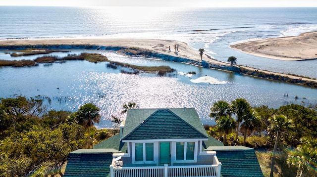 aerial view with a water view and a beach view