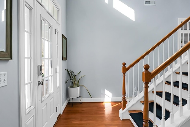 entryway with hardwood / wood-style flooring