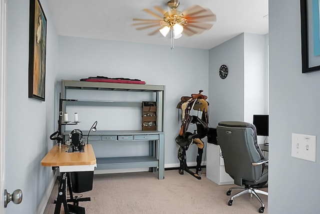 carpeted home office with ceiling fan