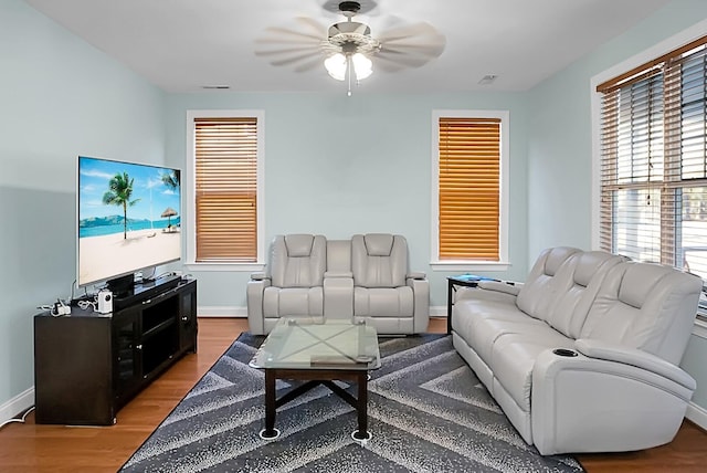 living room with hardwood / wood-style floors and ceiling fan