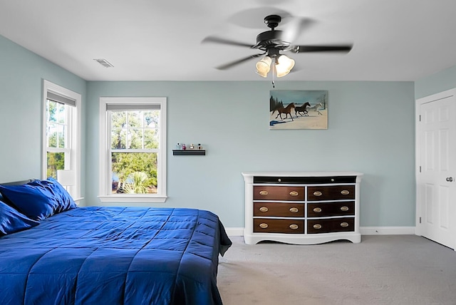 carpeted bedroom with ceiling fan