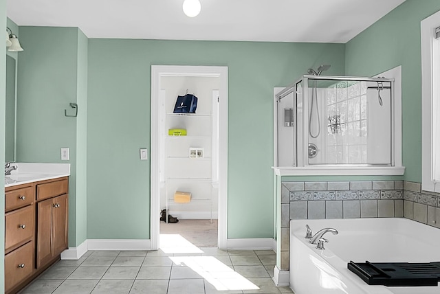 bathroom featuring tile patterned flooring, vanity, and independent shower and bath