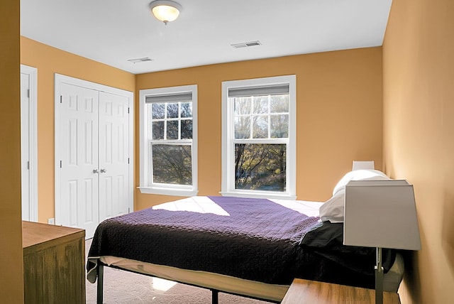 bedroom with multiple windows