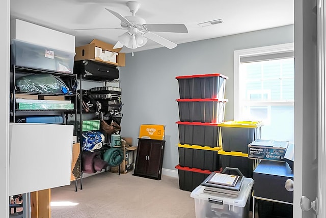 storage area featuring ceiling fan