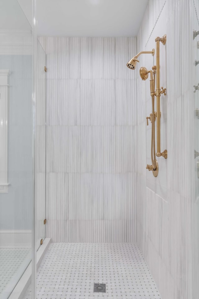 full bath with a tile shower