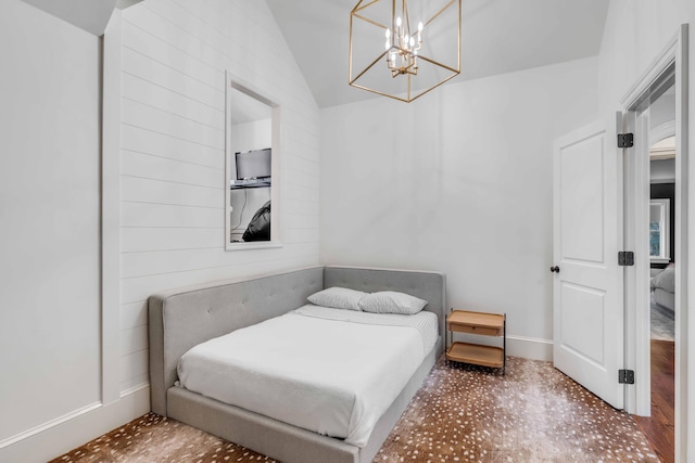 bedroom featuring baseboards and vaulted ceiling