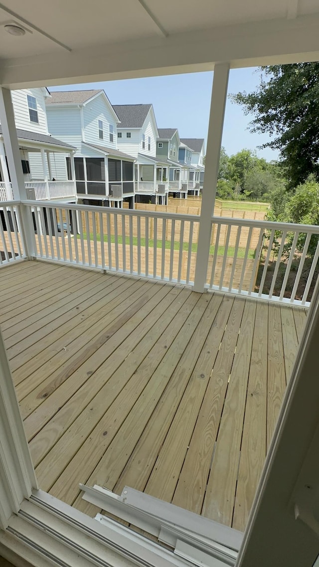 1082 Glenshaw St, North Charleston, SC 29405 - wooden terrace featuring a residential view, a sunroom, and a lawn