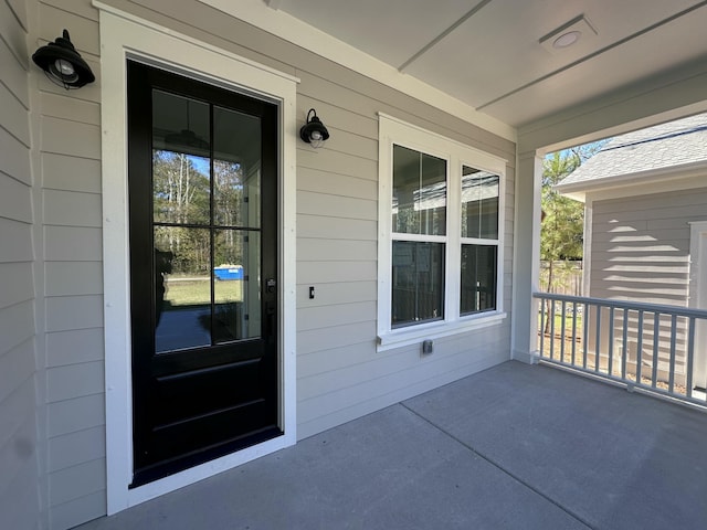 doorway to property featuring a porch