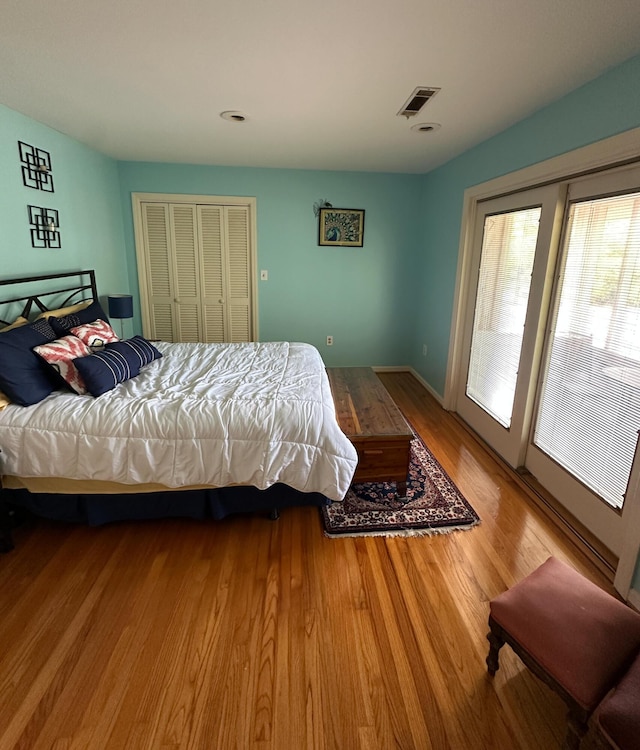 1866 Capri Dr, Charleston, SC 29407 - bedroom with wood finished floors, access to outside, and a closet
