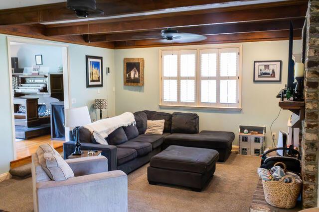 1866 Capri Dr, Charleston, SC 29407 - carpeted living area featuring beamed ceiling and ceiling fan