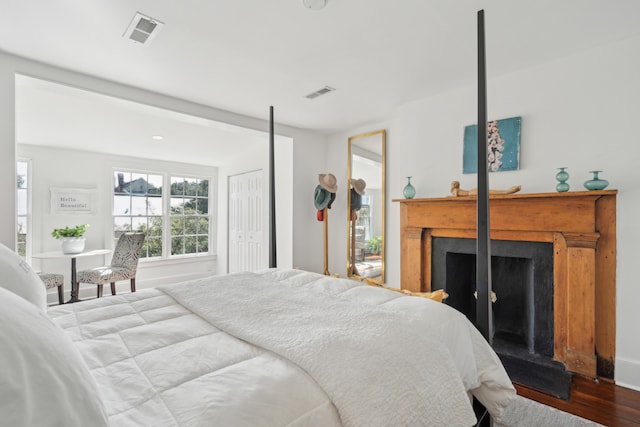 bedroom with hardwood / wood-style flooring and a closet