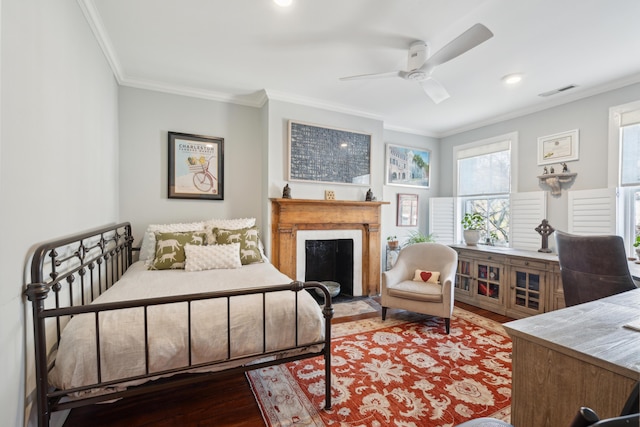 bedroom featuring hardwood / wood-style flooring, ceiling fan, and ornamental molding