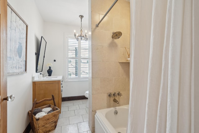 full bathroom featuring vanity, shower / bathtub combination with curtain, a notable chandelier, tile patterned flooring, and toilet