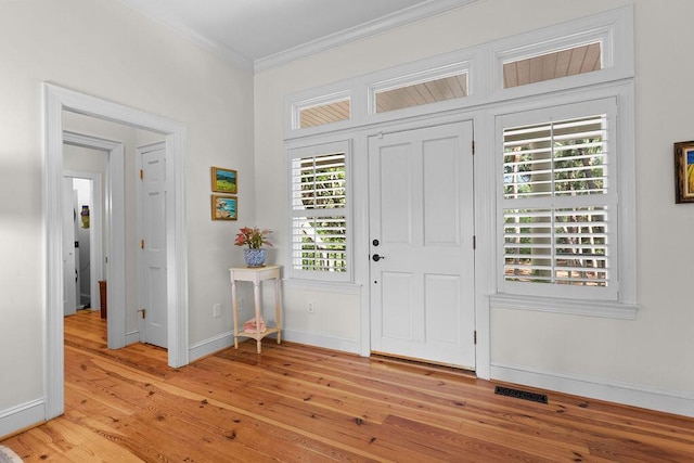 3052 Seabrook Island Rd, Seabrook Island, SC 29455 - entrance foyer with crown molding, light wood-type flooring, and baseboards