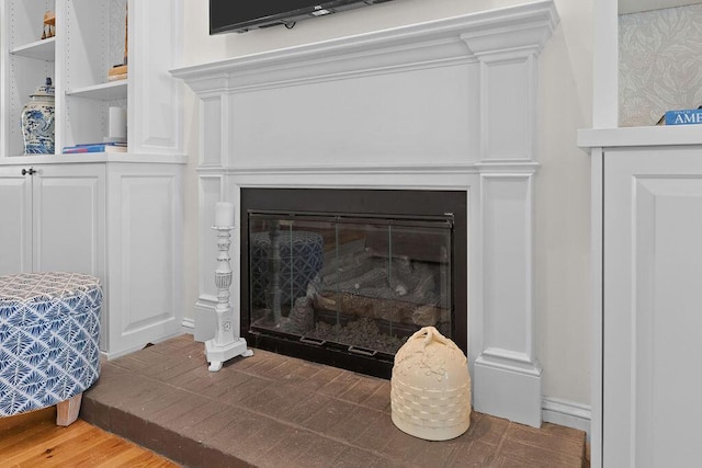 3052 Seabrook Island Rd, Seabrook Island, SC 29455 - detailed view of a glass covered fireplace and wood finished floors