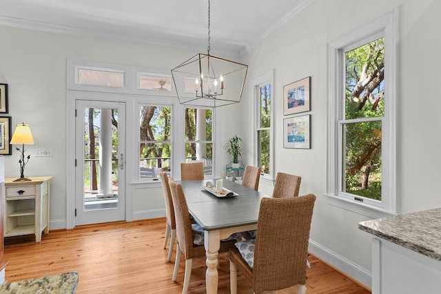 3052 Seabrook Island Rd, Seabrook Island, SC 29455 - dining space with crown molding, a chandelier, light wood-type flooring, and baseboards