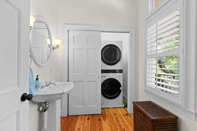 3052 Seabrook Island Rd, Seabrook Island, SC 29455 - bathroom with estacked washer and dryer and wood finished floors