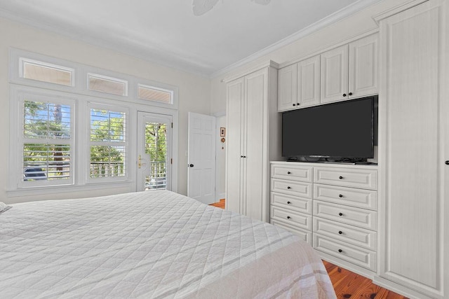 3052 Seabrook Island Rd, Seabrook Island, SC 29455 - bedroom with access to exterior, ornamental molding, multiple windows, and wood finished floors