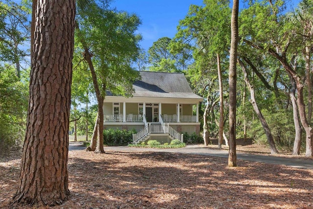 3052 Seabrook Island Rd, Seabrook Island, SC 29455 - raised beach house featuring stairway and a porch