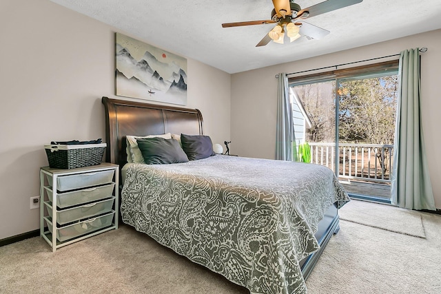 carpeted bedroom featuring a textured ceiling, baseboards, a ceiling fan, and access to exterior