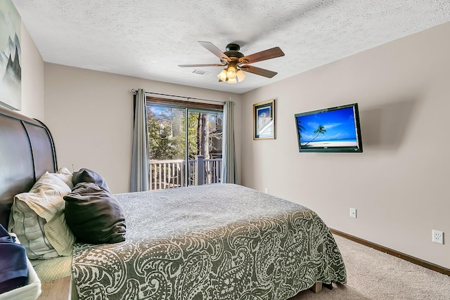 bedroom featuring carpet, a ceiling fan, a textured ceiling, access to outside, and baseboards