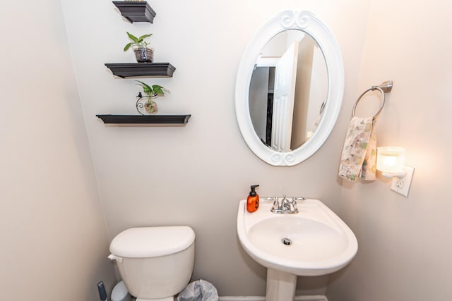 bathroom featuring sink and toilet