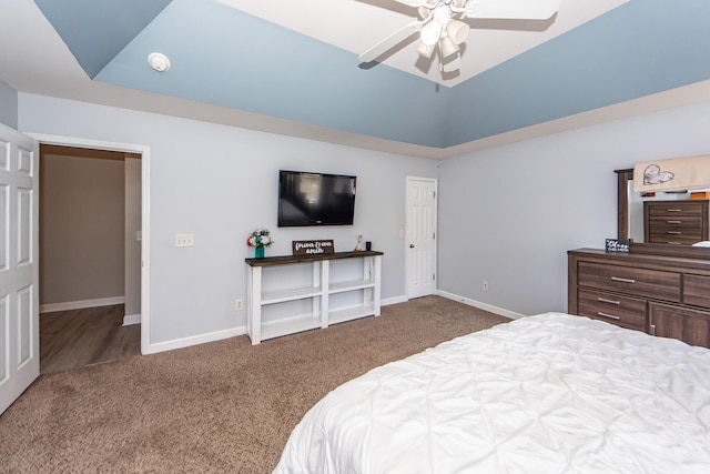 carpeted bedroom with vaulted ceiling and ceiling fan