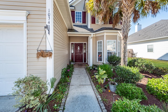 doorway to property featuring a garage