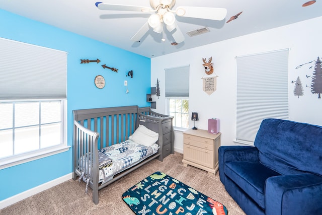 carpeted bedroom with ceiling fan