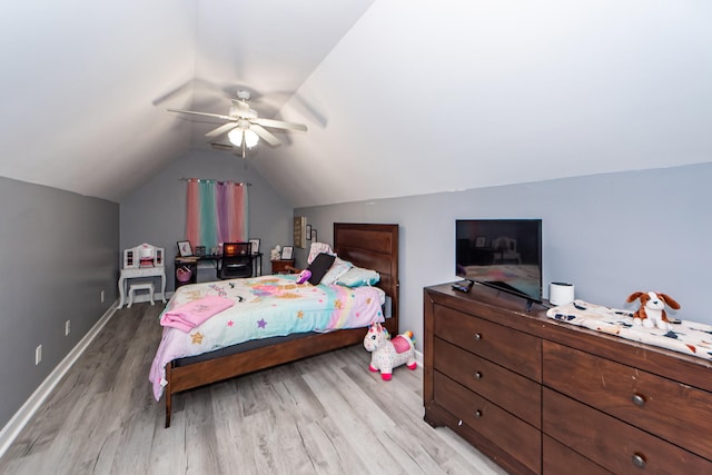 bedroom featuring vaulted ceiling, light wood-type flooring, and ceiling fan