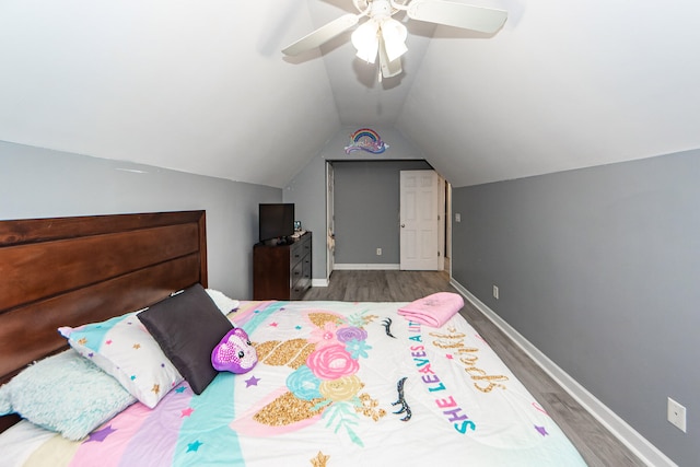 bedroom with lofted ceiling, hardwood / wood-style flooring, and ceiling fan