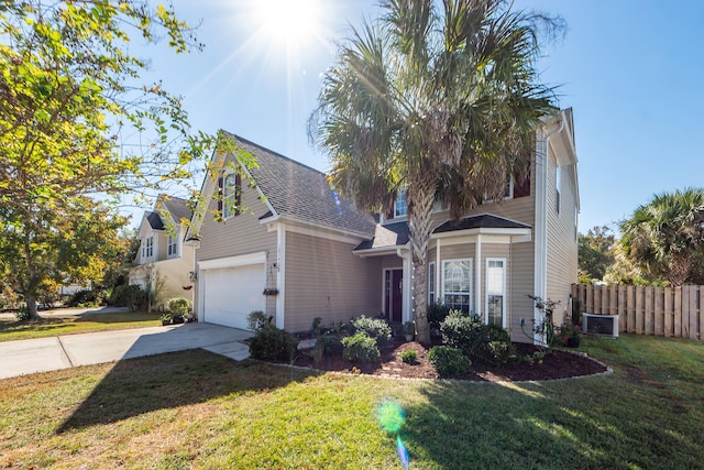 view of front of house featuring central AC and a front lawn