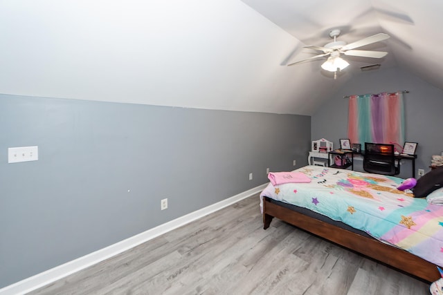 bedroom featuring vaulted ceiling, light hardwood / wood-style flooring, and ceiling fan