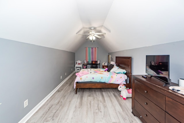 bedroom featuring light hardwood / wood-style flooring, ceiling fan, and vaulted ceiling