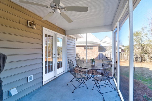 sunroom featuring ceiling fan