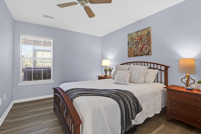 bedroom featuring ceiling fan and dark hardwood / wood-style floors