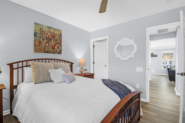 bedroom featuring ceiling fan and hardwood / wood-style floors