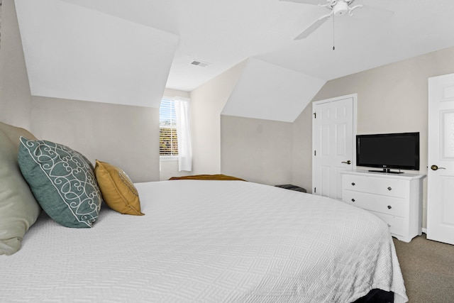 carpeted bedroom with ceiling fan and lofted ceiling