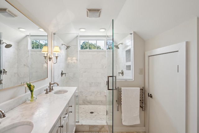 bathroom with vanity, an enclosed shower, and vaulted ceiling