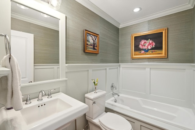 bathroom featuring sink, ornamental molding, toilet, and a tub to relax in