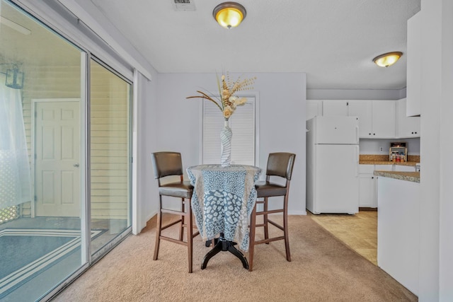6231 Rolling Fork Rd Unit 1201-A, North Charleston, SC 29406 - dining room featuring light carpet and baseboards