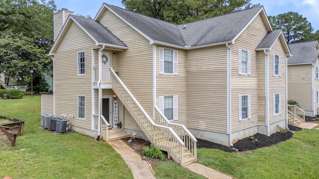 6231 Rolling Fork Rd Unit 1201-A, North Charleston, SC 29406 - view of front of property featuring a chimney, cooling unit, a front yard, and stairs