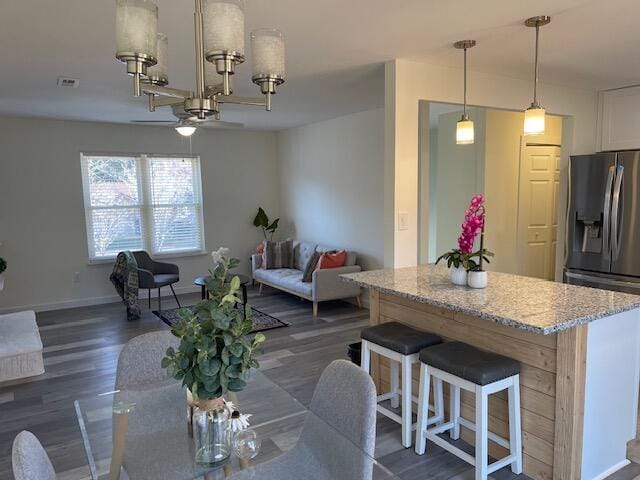 dining area with dark hardwood / wood-style flooring