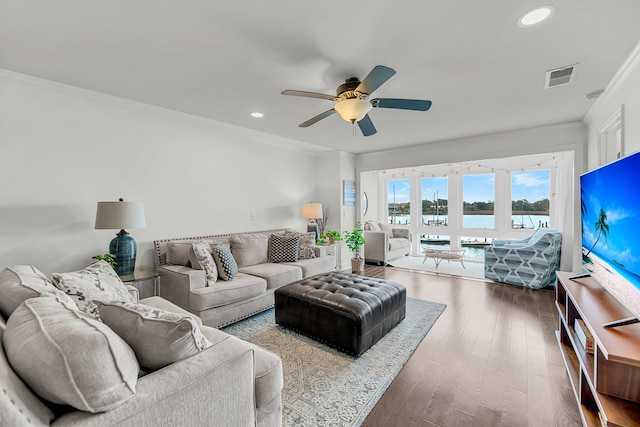 living room with ornamental molding, wood finished floors, ceiling fan, and recessed lighting