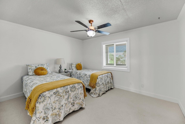 bedroom with carpet, baseboards, a textured ceiling, and a ceiling fan