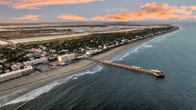 aerial view at dusk of view of water and beach
