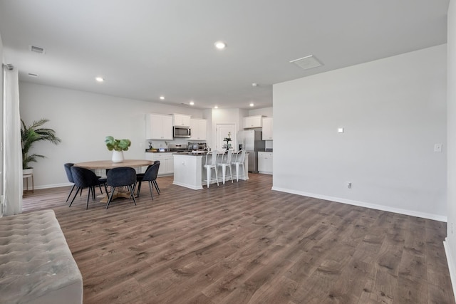 411 Bering Ln, Summerville, SC 29486 - living area with dark wood-style floors, baseboards, and recessed lighting